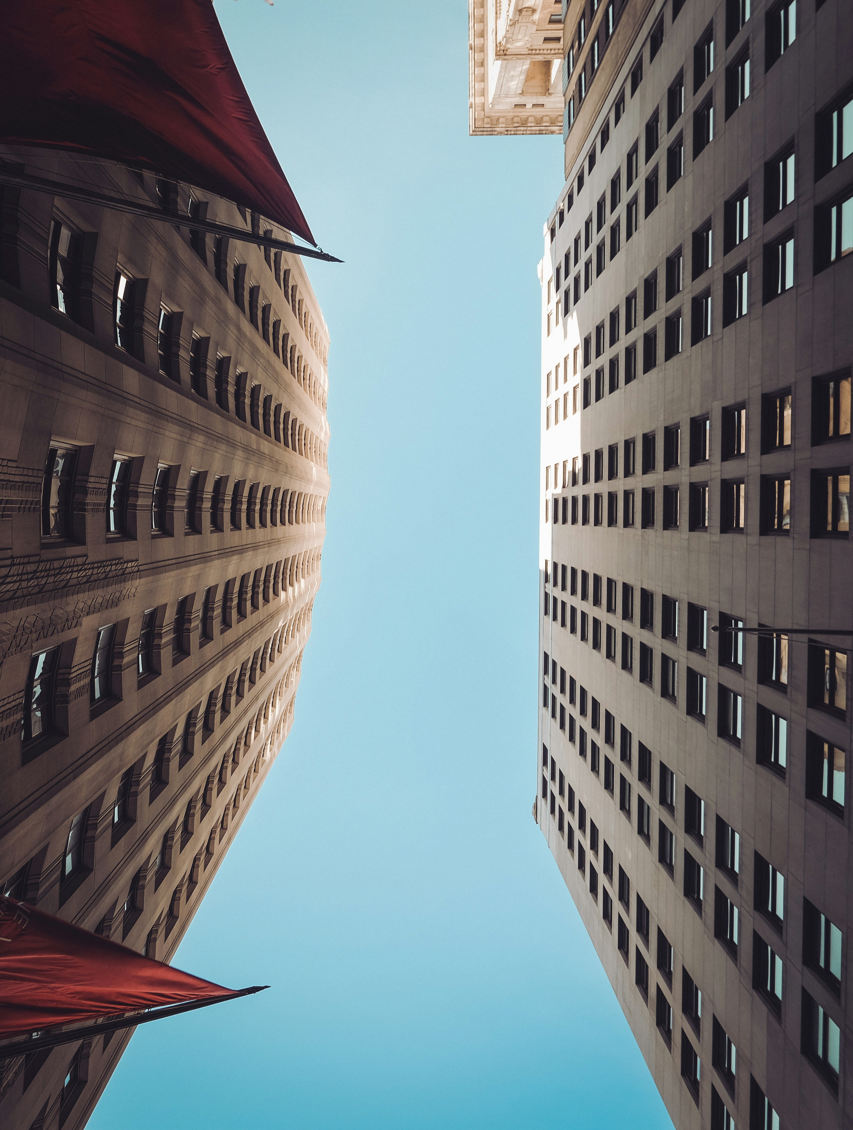 Licensed stock photograph looking up between completed commercial buildings in New York’s Financial District
